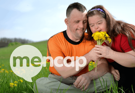 Family smelling flowers Mencap Thumbnail